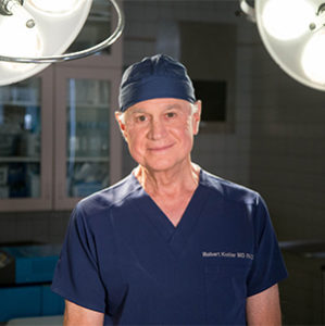 Dr. Robert Kotler, a Beverly Hills rhinoplasty specialist, in blue scrubs